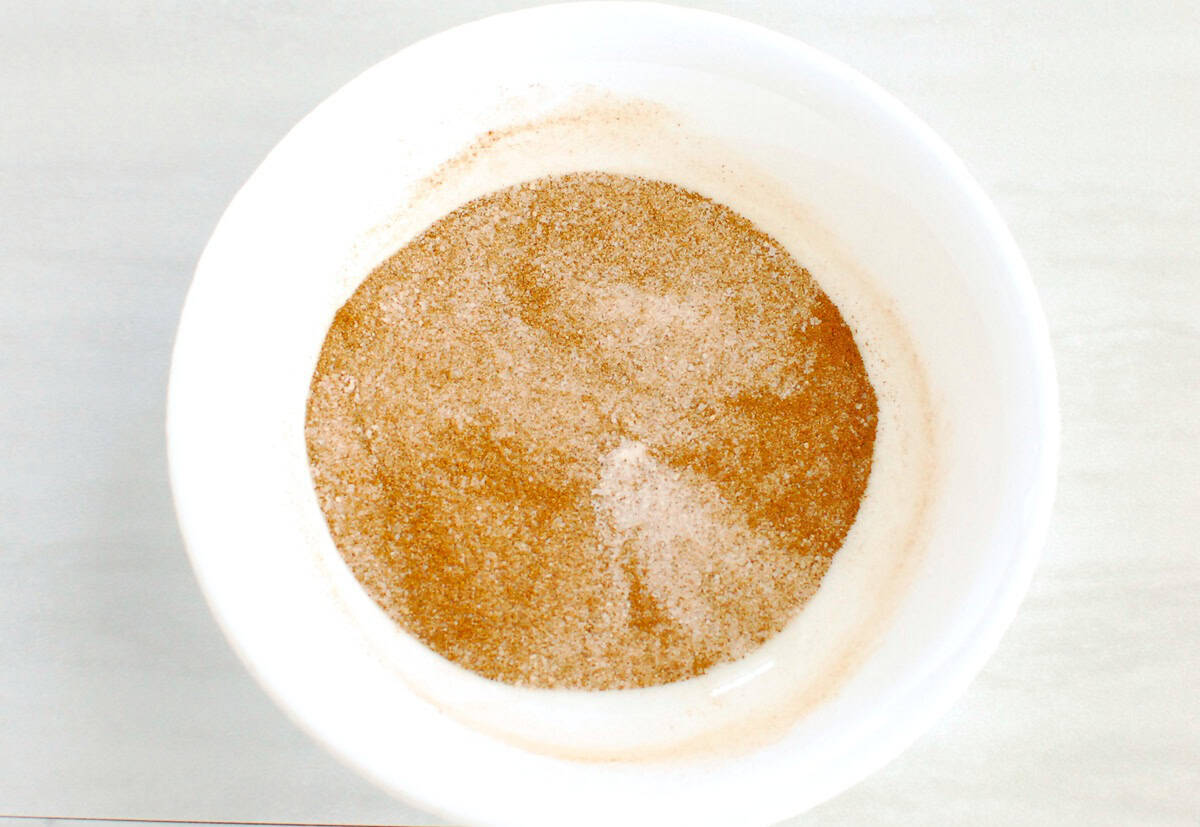 Cinnamon, sugar, and allulose mixed together in a small bowl.
