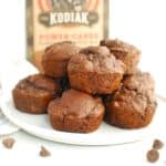 A white plate filled with dark chocolate protein muffins made with Kodiak pancake mix.
