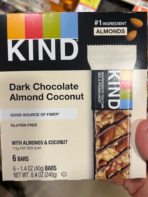 A box of dark chocolate almond coconut kind bars.