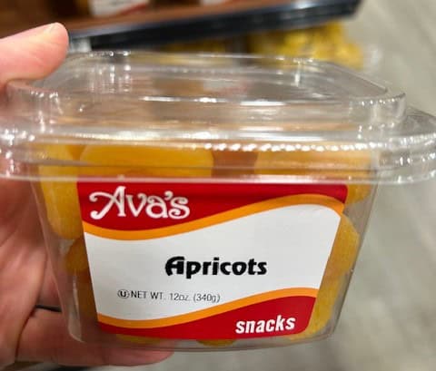 A container of dried apricots.