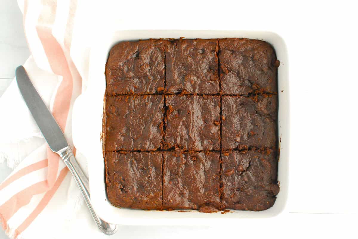 An 8 by 8 dish with brownies sliced into 9 servings.