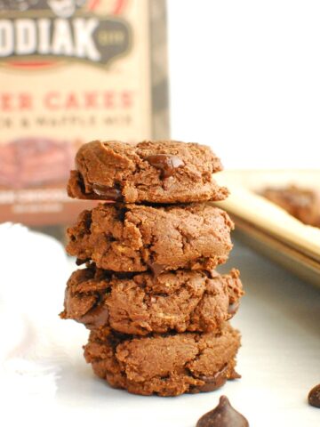 A stack of four Kodiak cakes double chocolate cookies.