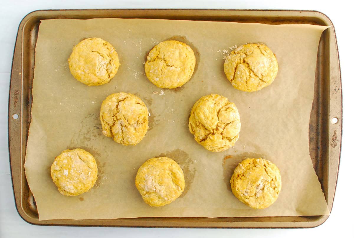 Biscuits on a parchment-lined baking sheet.