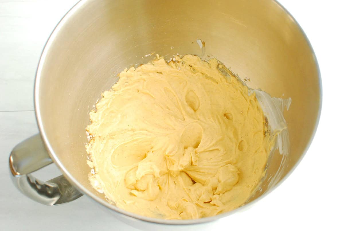 Sweetpotato whipped topping in a silver mixing bowl.