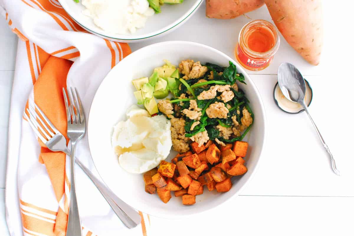 Overhead shot of a sweetpotato ricotta and ground chicken breakfast bowl.