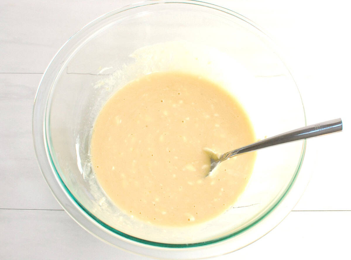 Yogurt, brown sugar, oil, egg, and vanilla whisked together in a bowl.