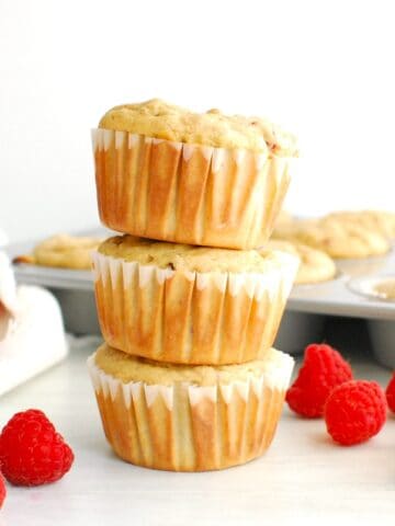 A stack of three Kodiak cakes raspberry muffins.