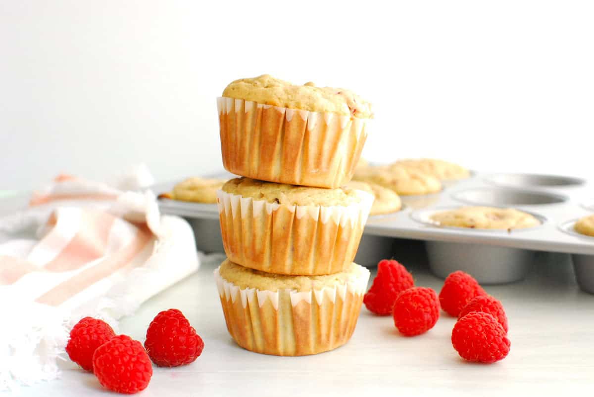 A stack of three Kodiak cakes raspberry muffins.