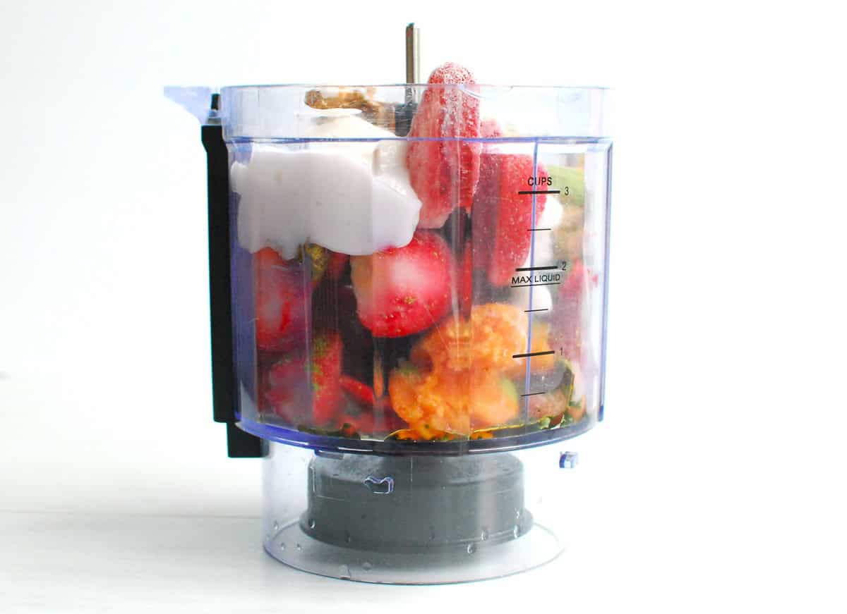 All of the ingredients placed into a mini food processor.