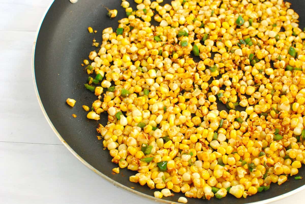Corn cooked in a skillet.