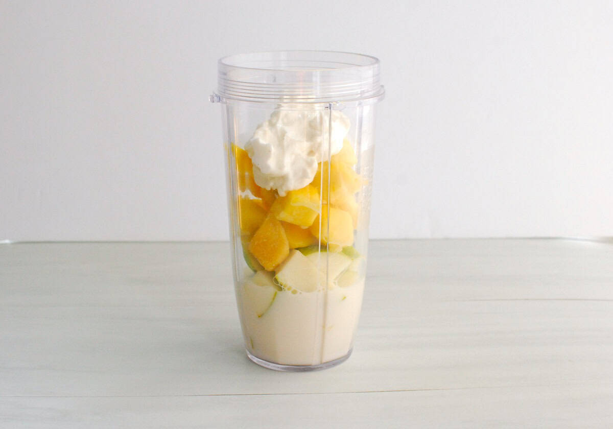 Smoothie ingredients in a blender cup.