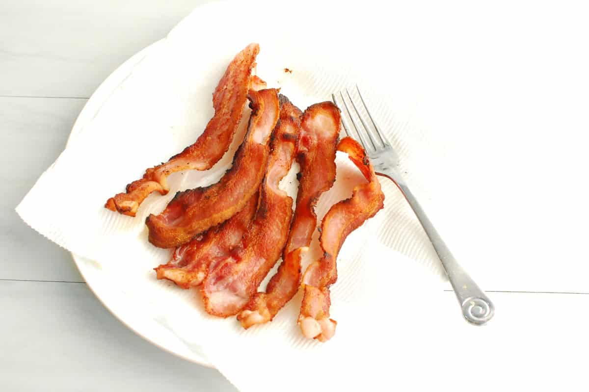Cooked bacon on a plate.