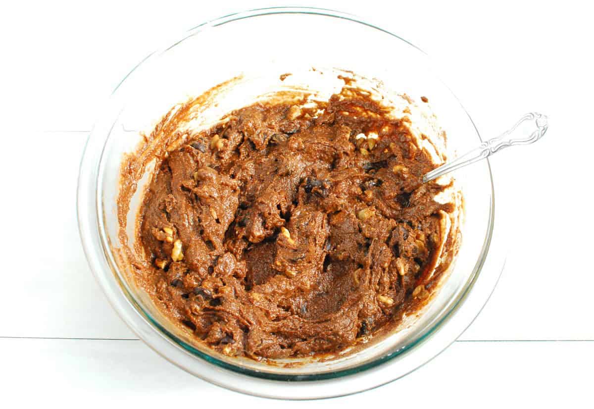Brownie batter in a glass bowl.