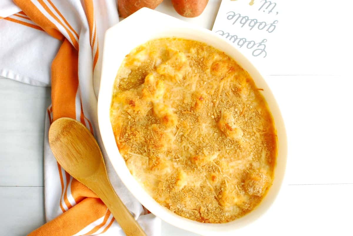 A casserole dish filled with sweetpotato cauliflower gratin.
