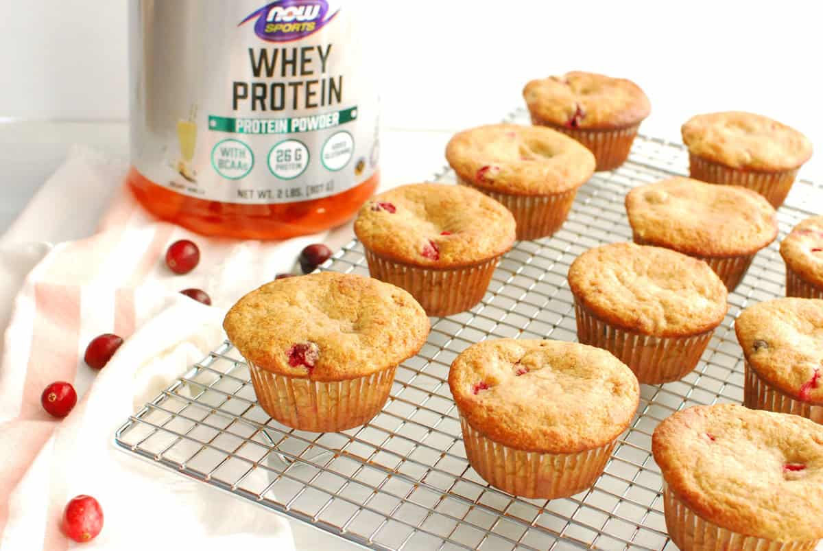 A cooling rack with cranberry protein muffins.