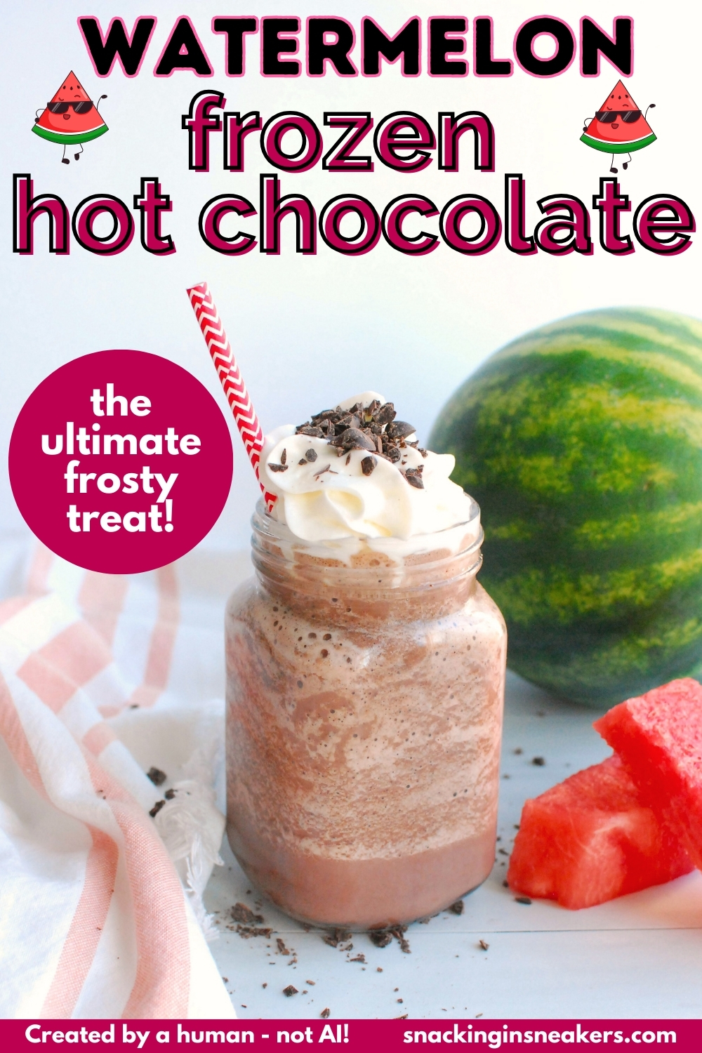 A mason jar filled with watermelon frozen hot chocolate, topped with whipped cream and chocolate.