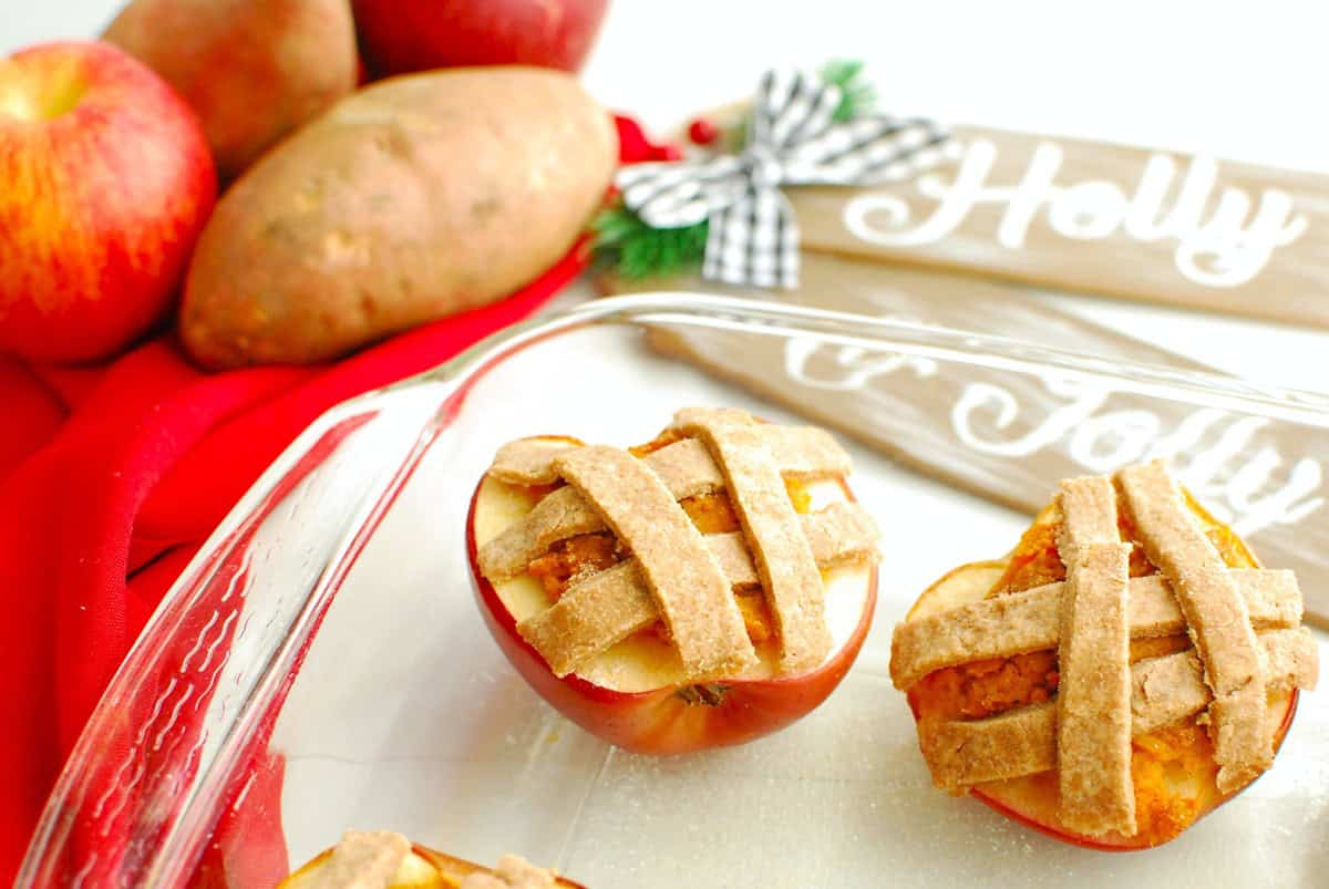 Baked apples in a glass casserole dish.