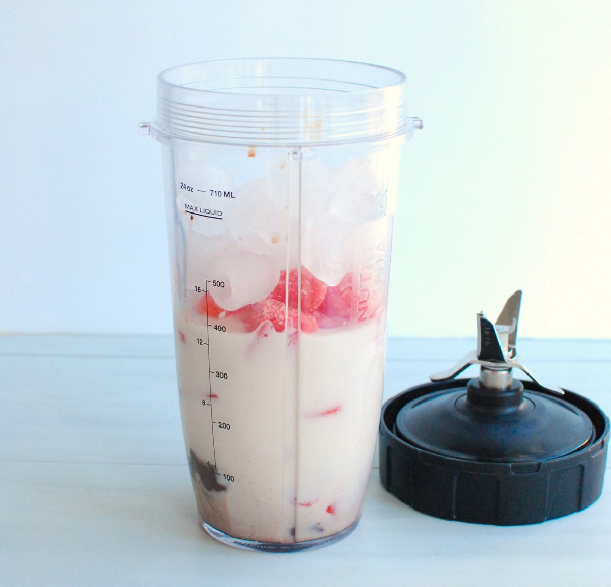 All the ingredients in a blender cup.