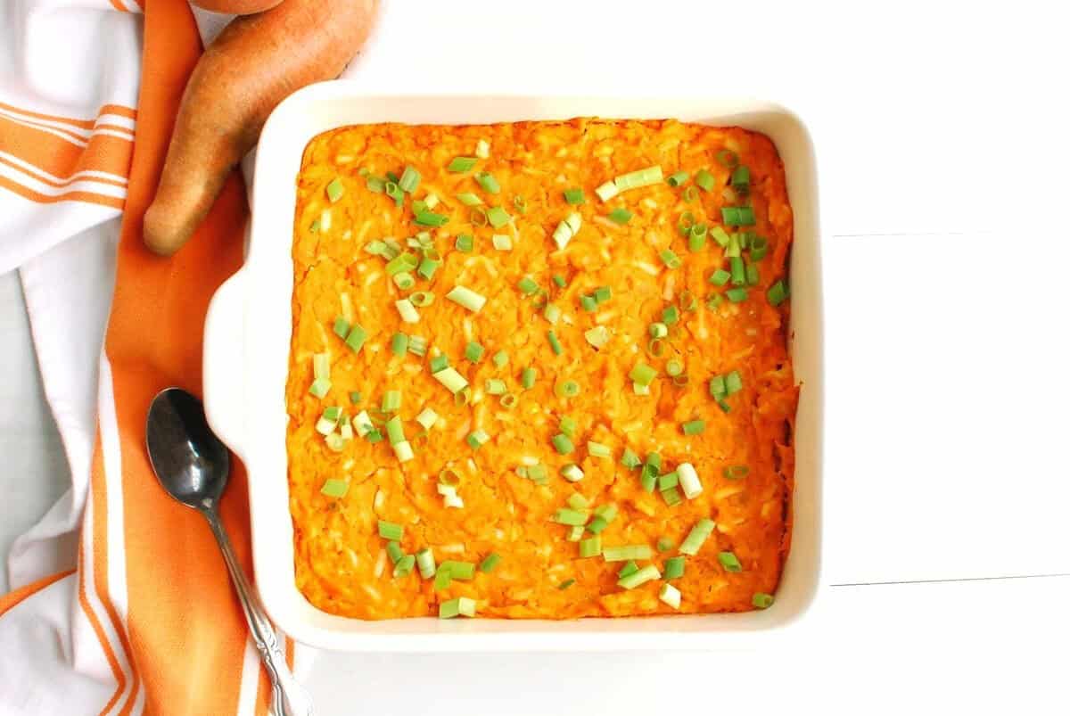 A casserole dish of sweetpotato chickpea buffalo dip.