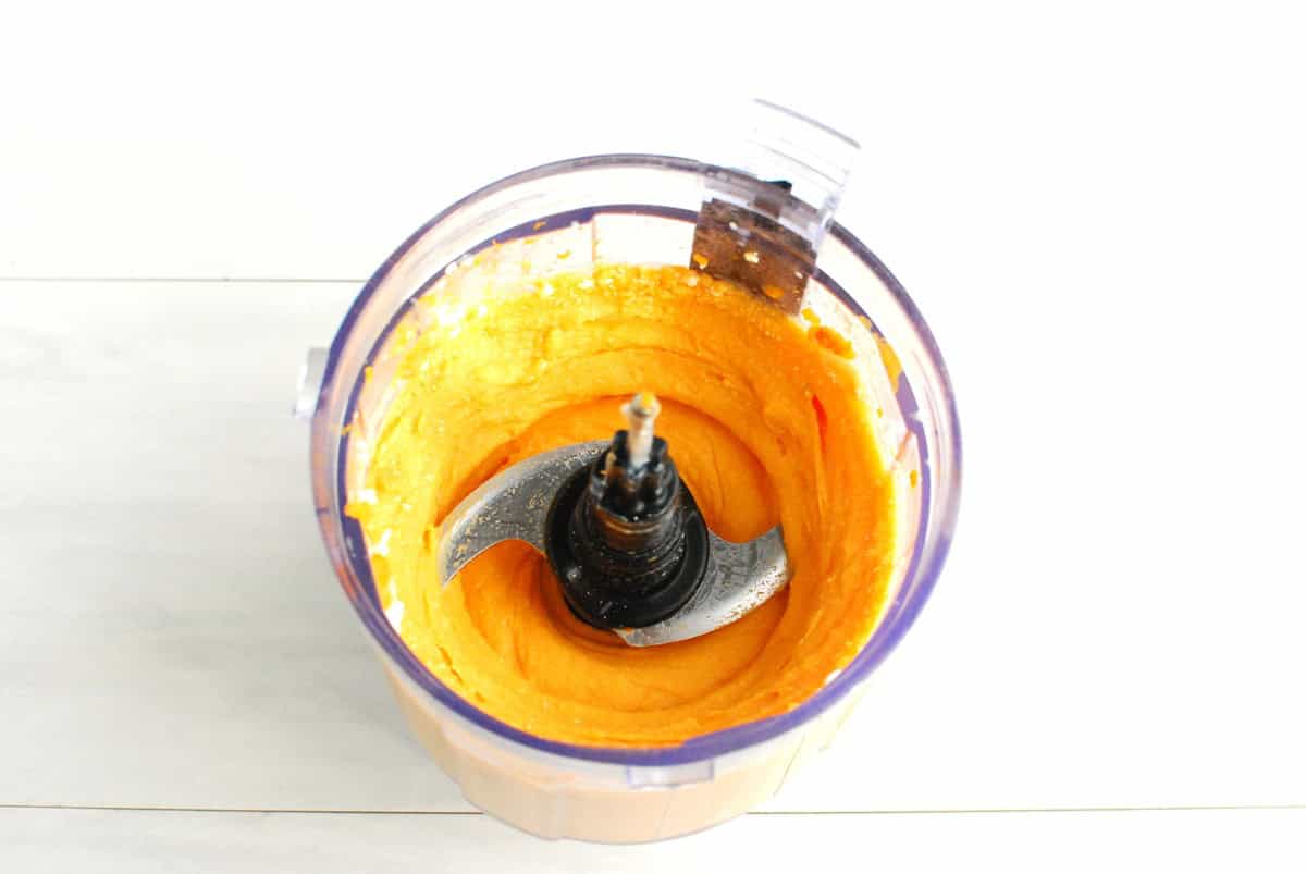 Sweetpotatoes pureed in a mini food processor bowl.