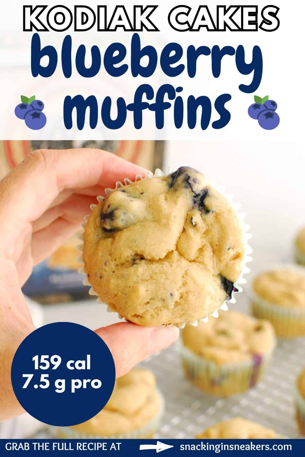 A woman's hand holding a Kodiak Cakes blueberry muffin, with a text overlay with the name of the recipe.