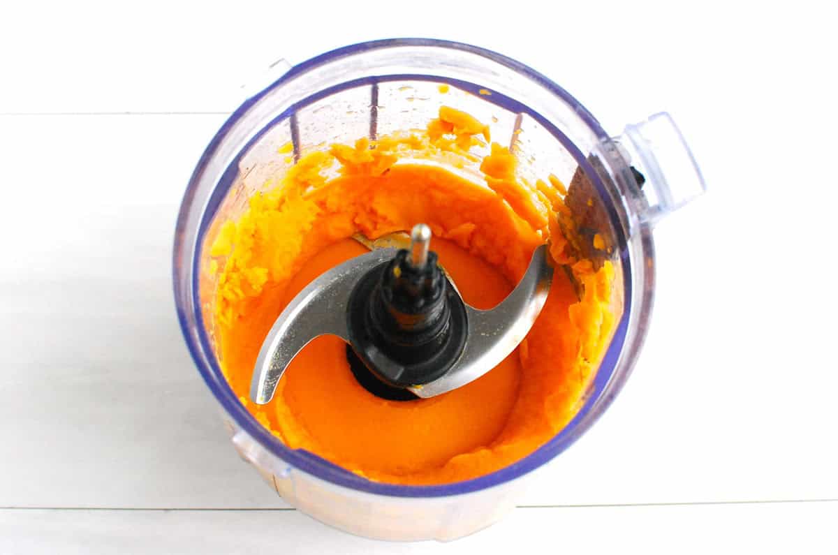 Sweetpotato puree in a mini food processor bowl.