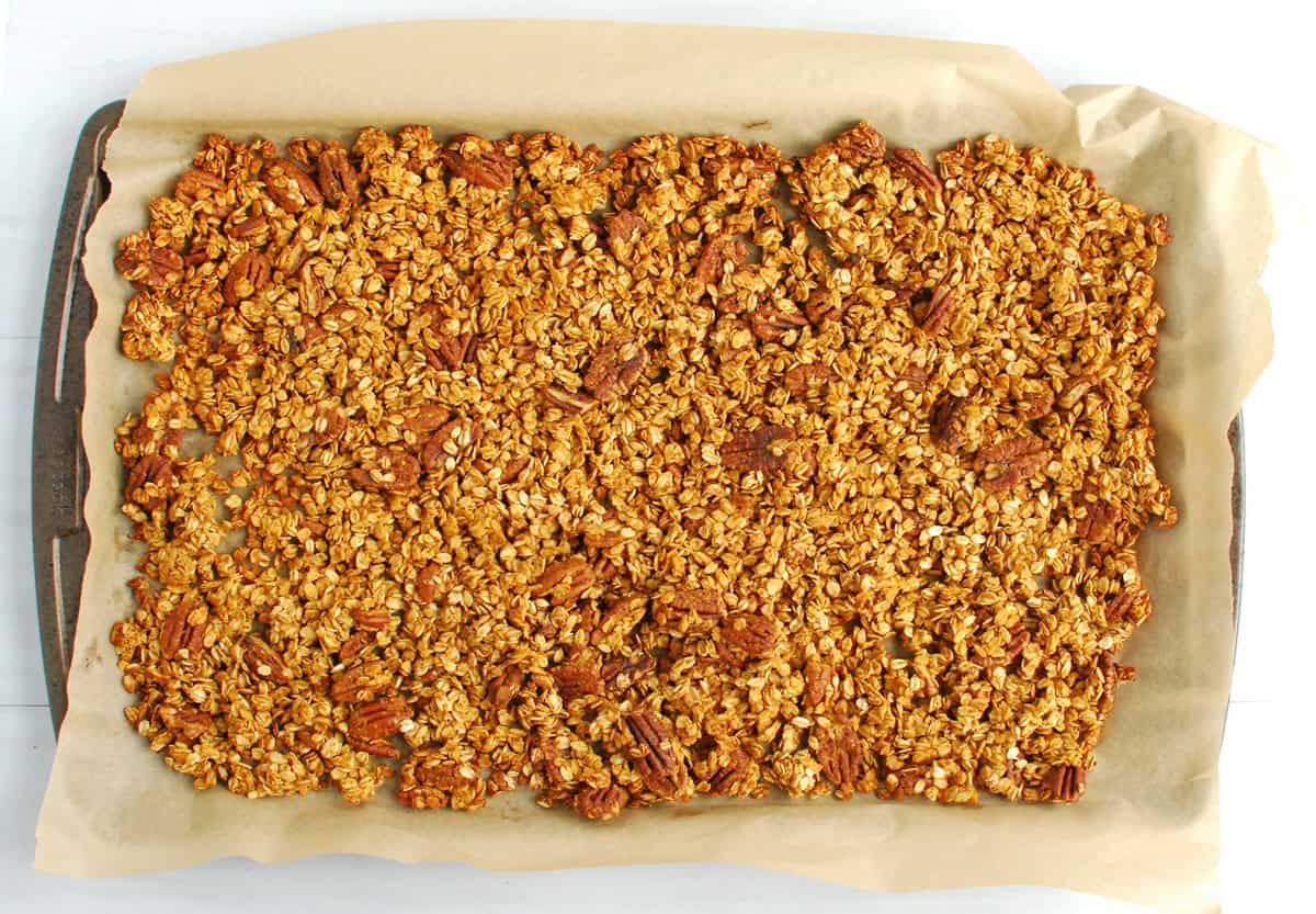 Cooked granola on a baking sheet.
