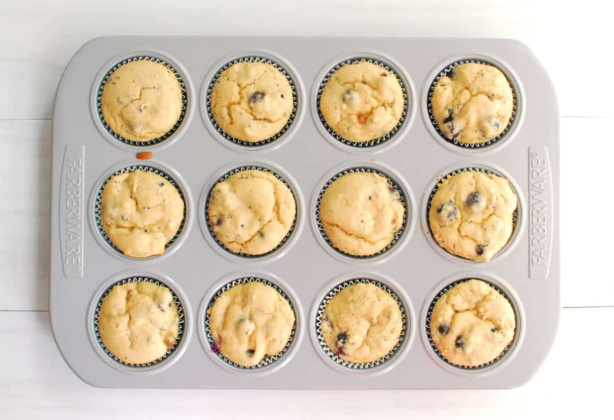 Just-baked muffins still in the muffin tin.