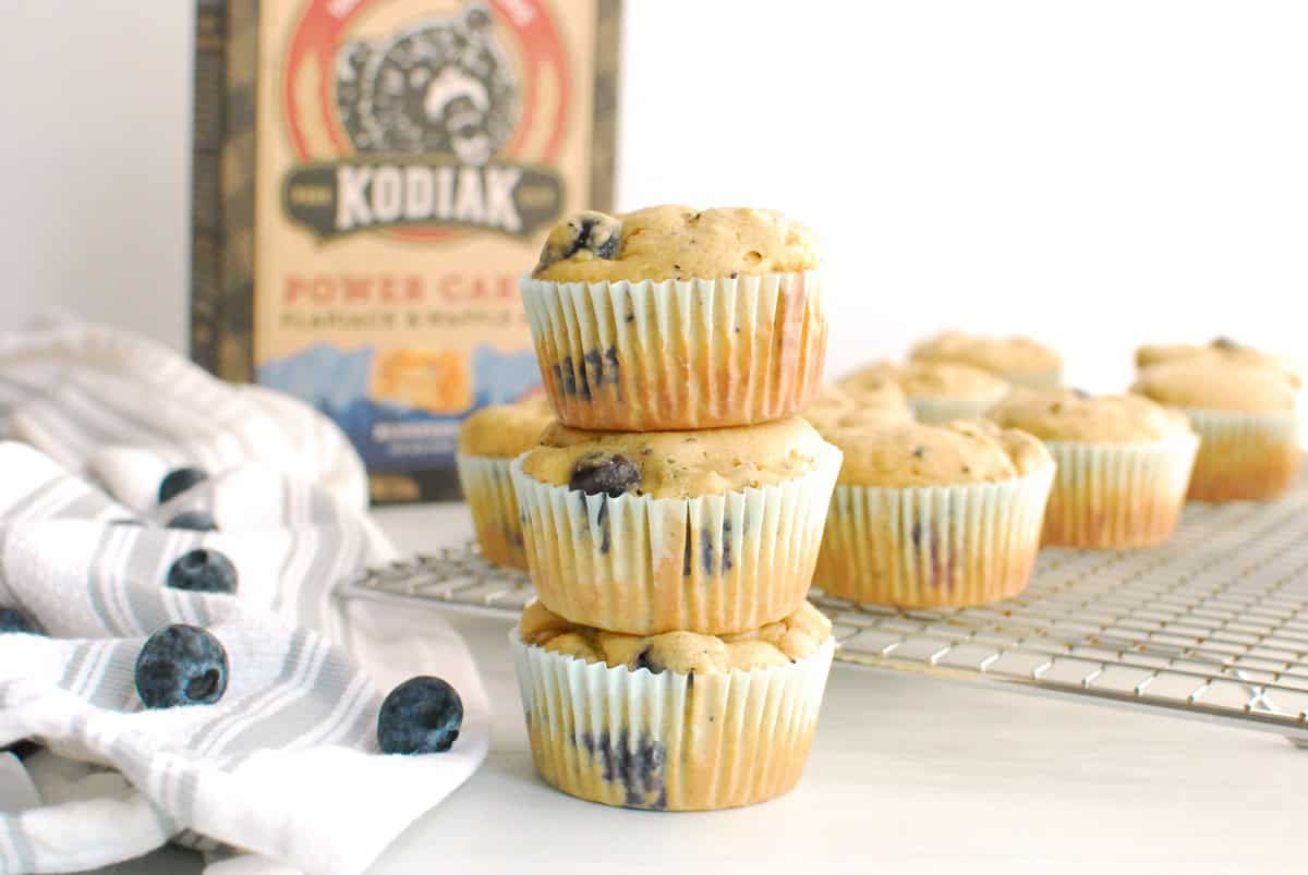 A stack of three Kodiak Cakes blueberry muffins.