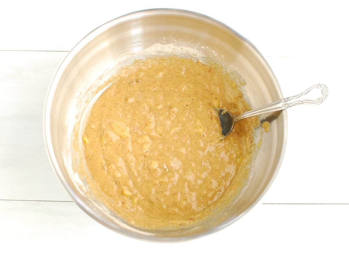 Banana bread batter in a mixing bowl.