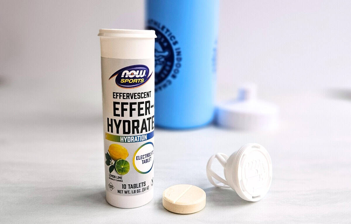 An electrolyte tab next to a water bottle.