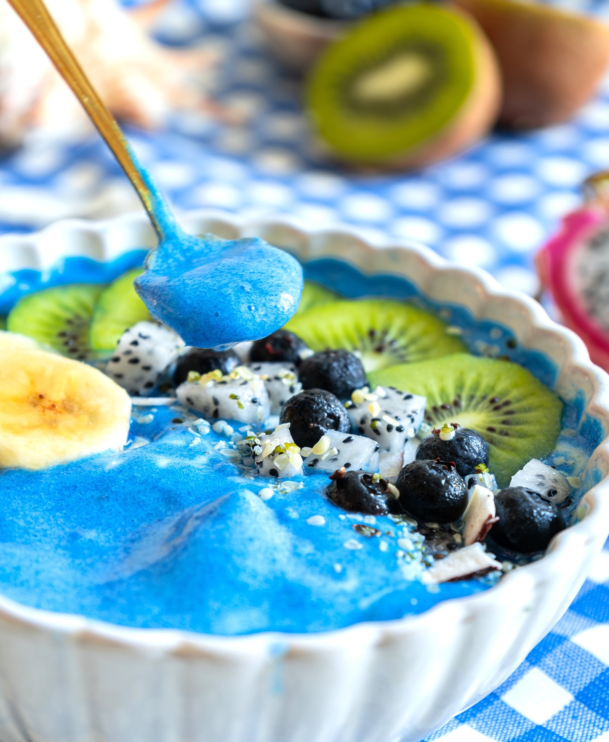 A spoon scooping up some of the smoothie bowl mixture.