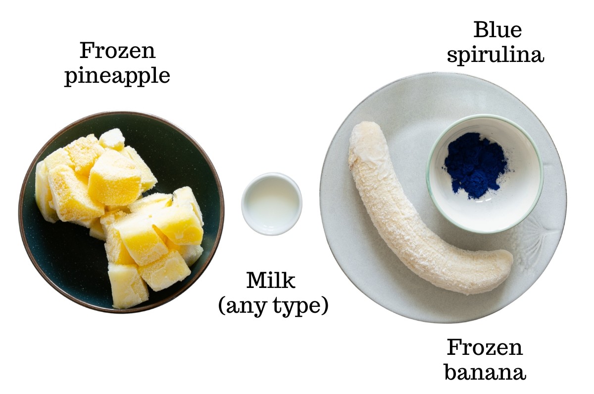 Frozen pineapple, frozen banana, milk, and blue spirulina.