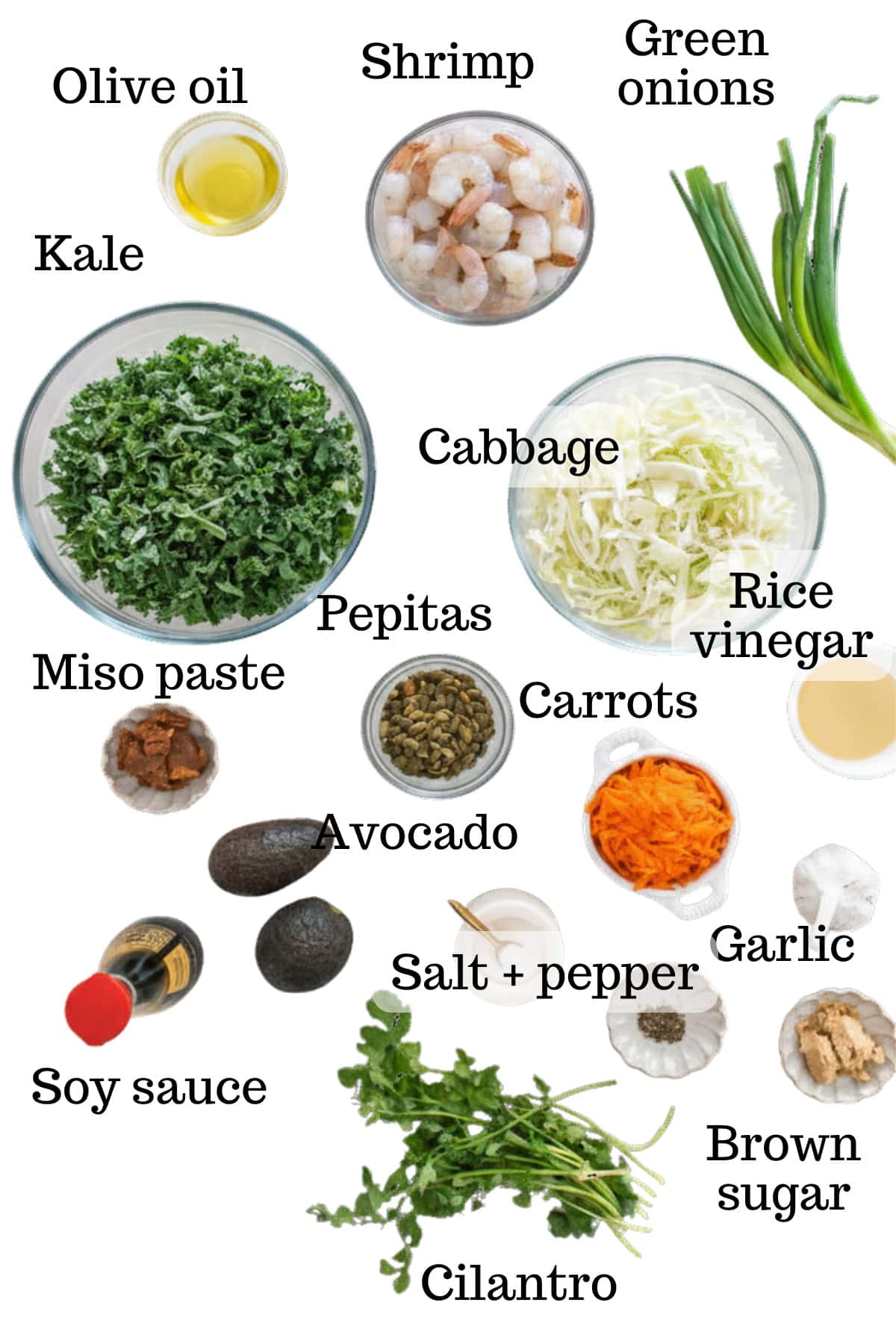 All of the salad ingredients on a white flat lay.