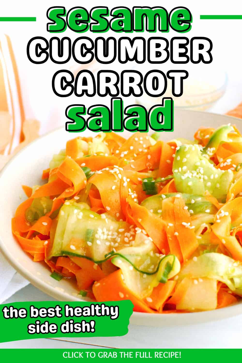 A sesame carrot and cucumber salad in a bowl with a text overlay with the name of the recipe.