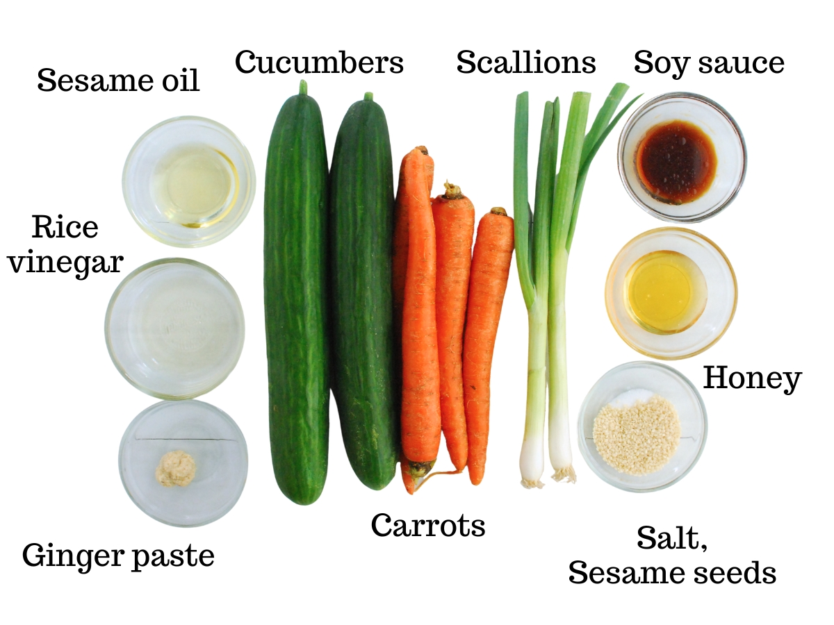 Cucumbers, carrots, scallions, sesame oi, rice vinegar, ginger paste, soy sauce, honey, salt, and sesame seeds.