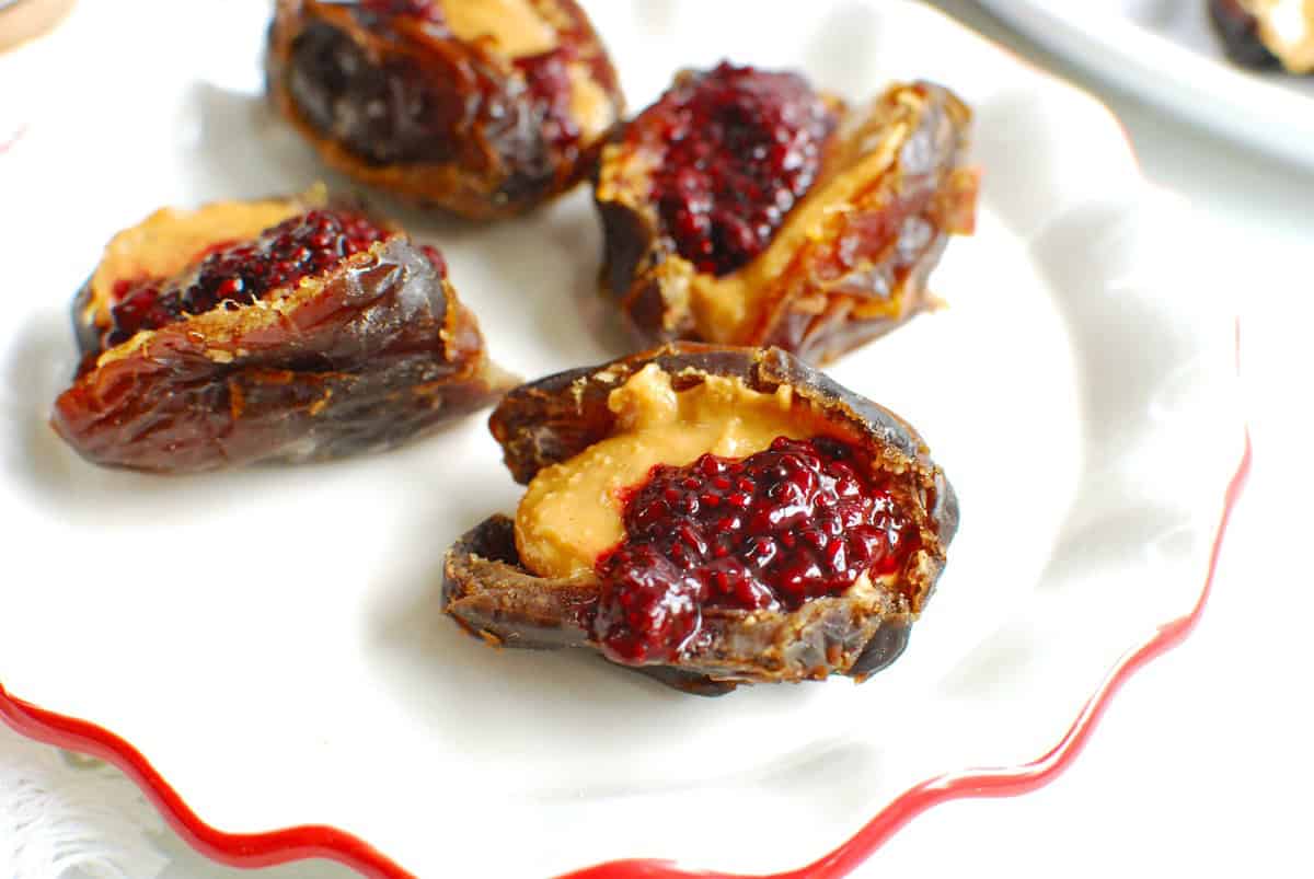 A close up of a peanut butter and jelly stuffed date.