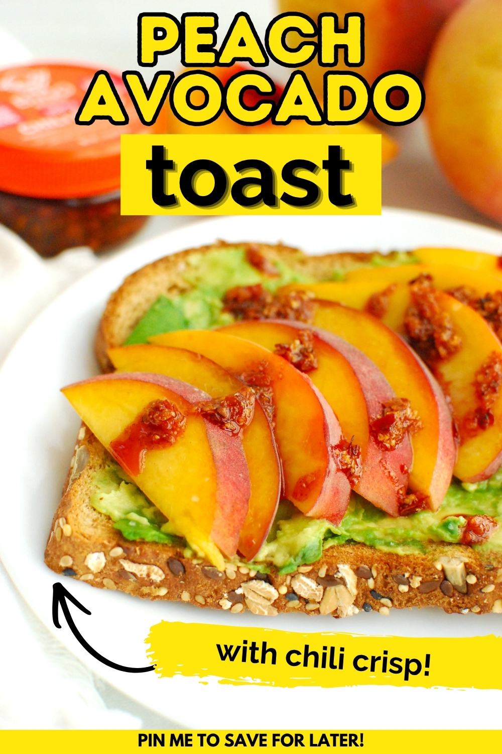 A slice of peach avocado toast with chili crisp with a text overlay with the name of the recipe.