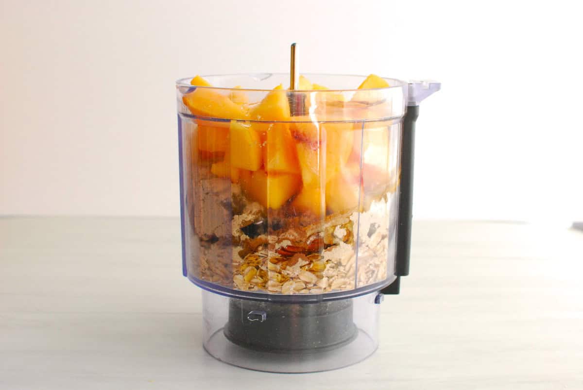All the ingredients added to a mini food processor.