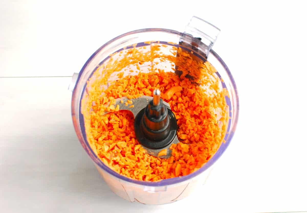 Sweetpotato processed finely in a mini food processor bowl.