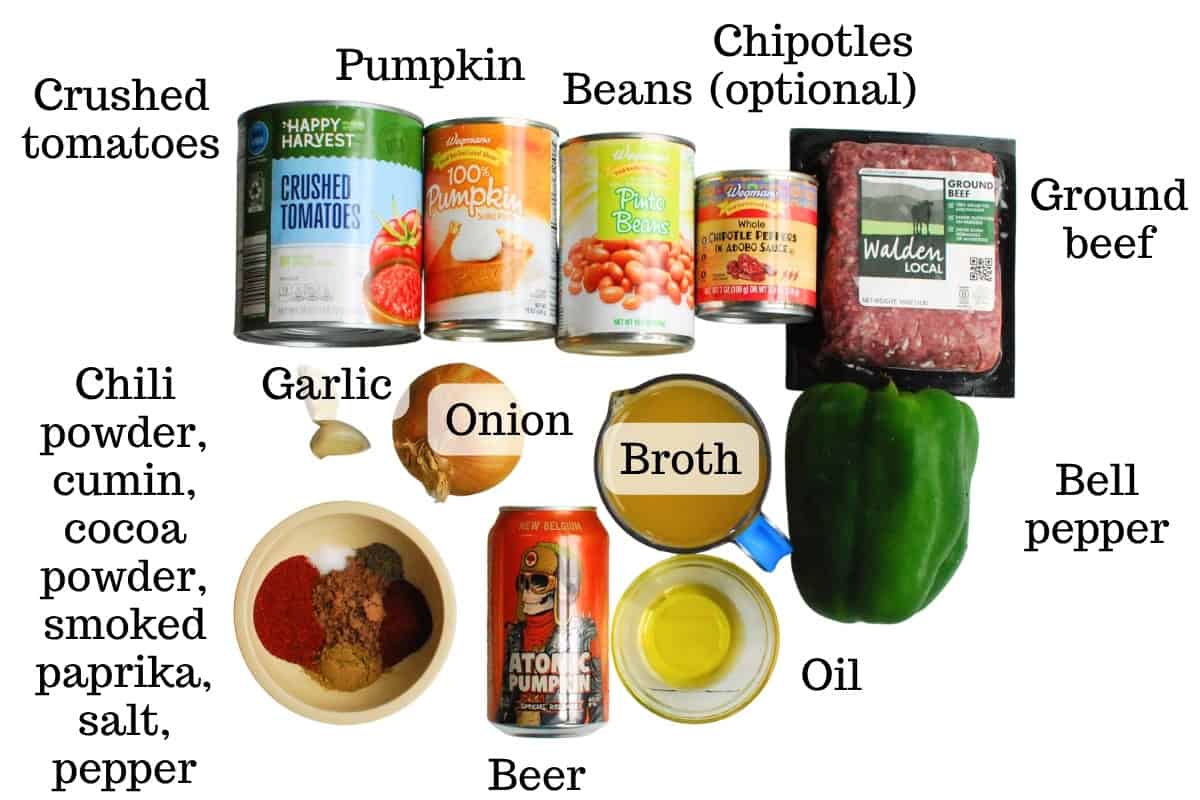 All of the ingredients for the chili on a white backdrop.