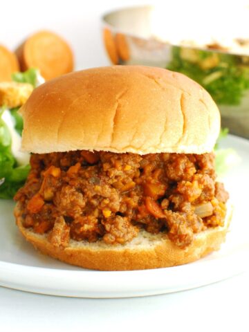 Beef and veggie sloppy joe mixture on a hamburger bun.