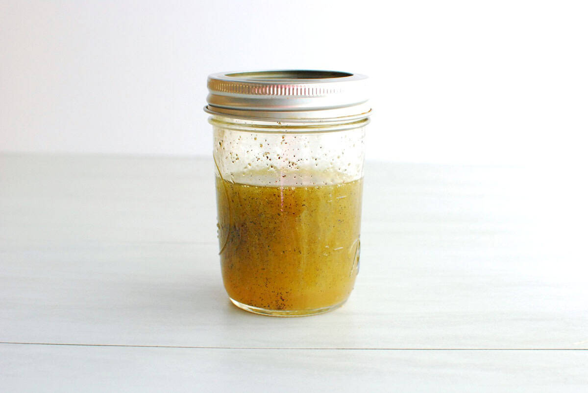 Dressing mixed in a small mason jar.