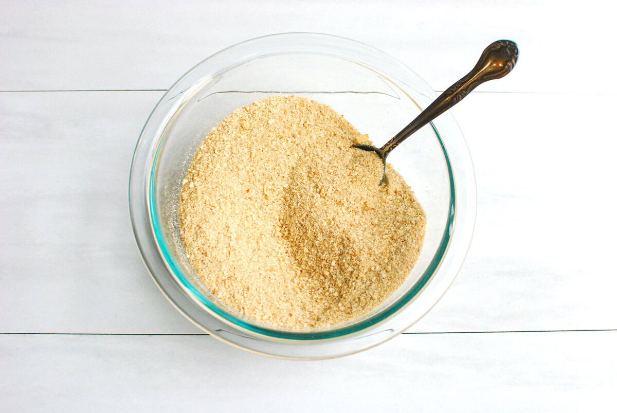 Breadcrumbs and spices mixed together in a bowl.