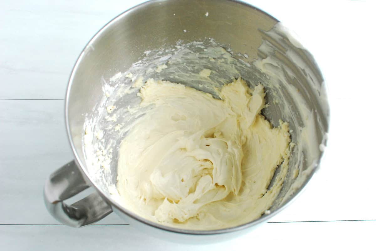 Protein frosting in a silver mixing bowl.
