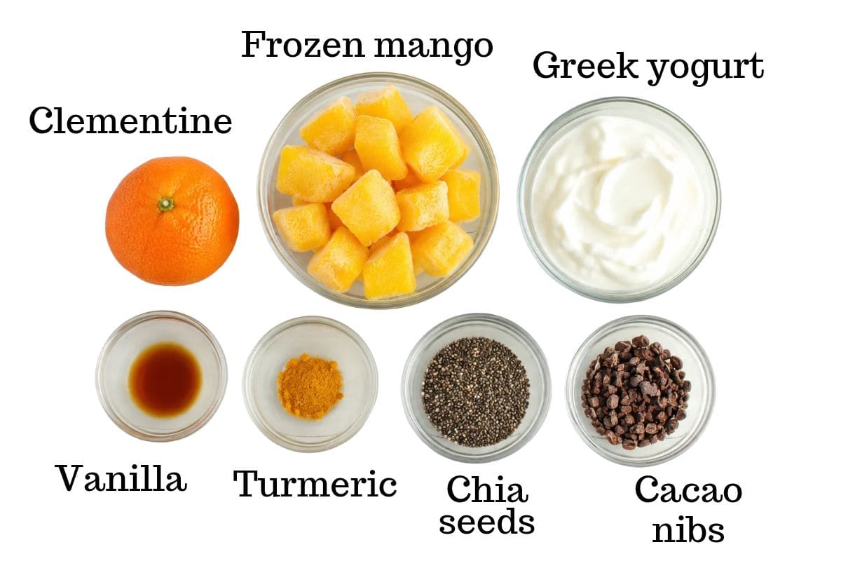 Clementine, frozen mango, greek yogurt, vanilla, turmeric, chia seeds, and cacao nibs.