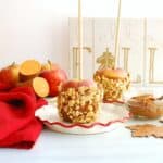A healthy caramel apple with sweetpotato-date caramel on a small plate.
